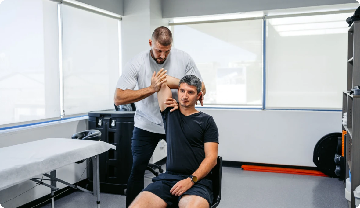 Therapist assisting patient with exercise